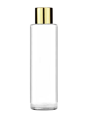 Cylinder design 50 ml, 1.7oz  clear glass bottle  with reducer and shiny gold cap.