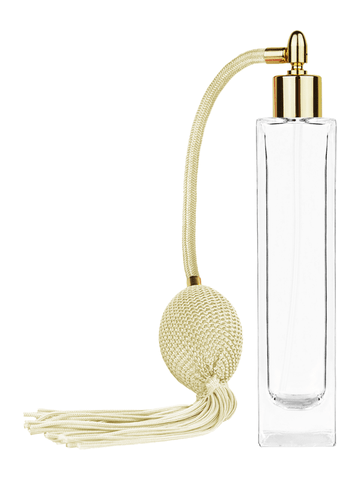 Sleek design 100 ml, 3 1/2oz  clear glass bottle  with Ivory vintage style bulb sprayer with tassel and shiny gold collar cap.