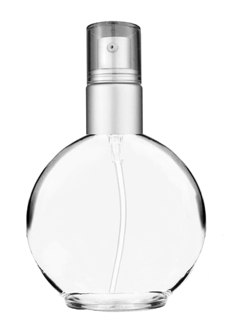 Round design 128 ml, 4.33oz  clear glass bottle  with with a matte silver collar treatment pump and clear overcap.