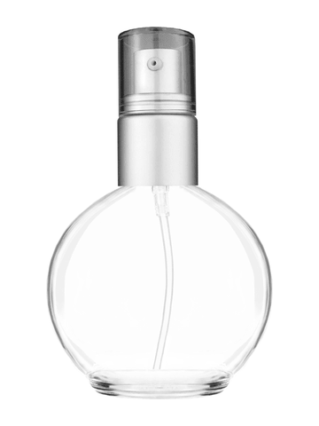 Round design 78 ml, 2.65oz  clear glass bottle  with with a matte silver collar treatment pump and clear overcap.